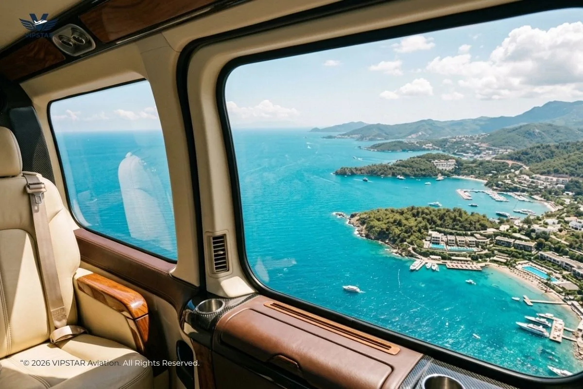 Bespoke Intercity Helicopter Cruise | VIPSTAR Aviation Premium view from a private VIP helicopter cabin window flying over the turquoise coastline and luxury resorts between Antalya and Bodrum
